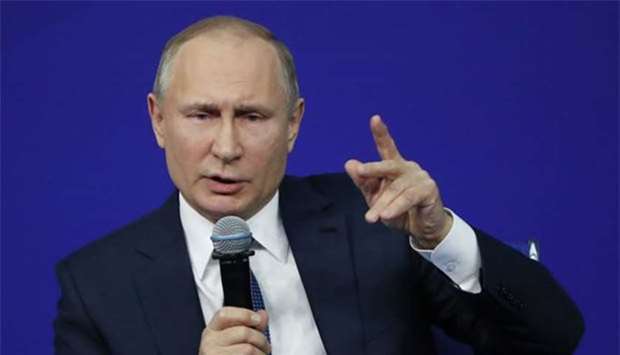 Russian President Vladimir Putin speaks during a meeting with his confidants ahead of the upcoming presidential election in Moscow on Tuesday.