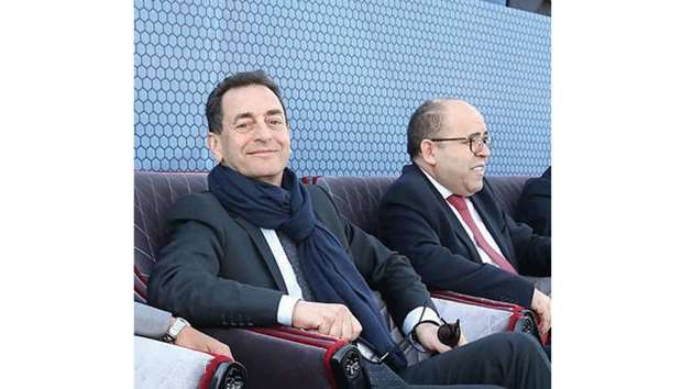 French ambassador to Qatar, Eric Chevallier (left) and Tunisian ambassador, Salah al-Salhi, watch the Al Kass semi-final between PSG and Esperance Sportive de Tunis on Monday.