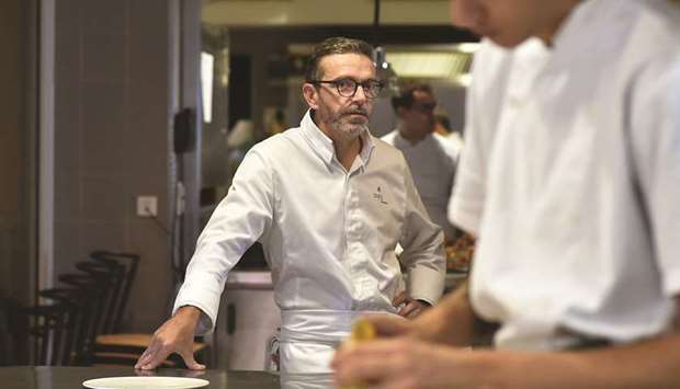 This file photo taken on September 21, 2017 shows chef Sebastien Bras in the kitchen of his three-star restaurant Le Suquet.
