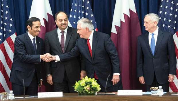 HE the Deputy Prime Minister and Foreign Minister Sheikh Mohamed bin Abdulrahman al-Thani shakes hands with US Secretary of State Rex Tillerson as HE the Deputy Prime Minister and Minister of State for Defence Affairs Dr Khalid bin Mohamed al-Attiyah and US Defence Secretary Jim Mattis look on prior to signing agreements in Washington, DC, yesterday.