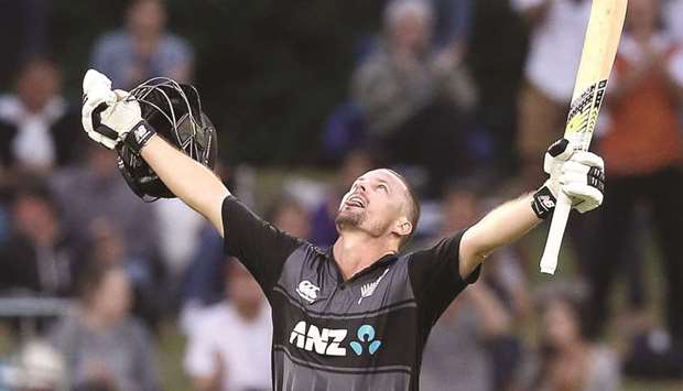 New Zealandu2019s Colin Munro celebrates after scoring a century during the third Twenty20 match against West Indies yesterday. (AFP)