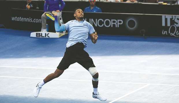 Nick Kyrgios of Australia hits a volley return against compatriot Matthew Ebden during their match at the Brisbane International yesterday. (AFP)