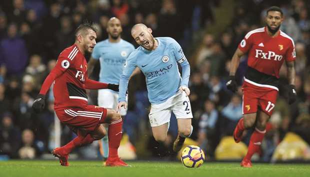 Manchester Cityu2019s David Silva is fouled by Watfordu2019s Roberto Pereyra (left) during the Premier League game on Tuesday. (Reuters)