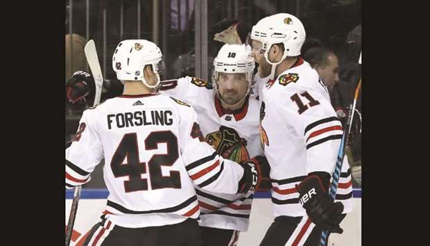 Chicago Blackhawks left wing Patrick Sharp (centre) celebrates with teammates after scoring a goal against the New York Rangers during the third period at Madison Square Garden. PICTURE: USA TODAY Sports