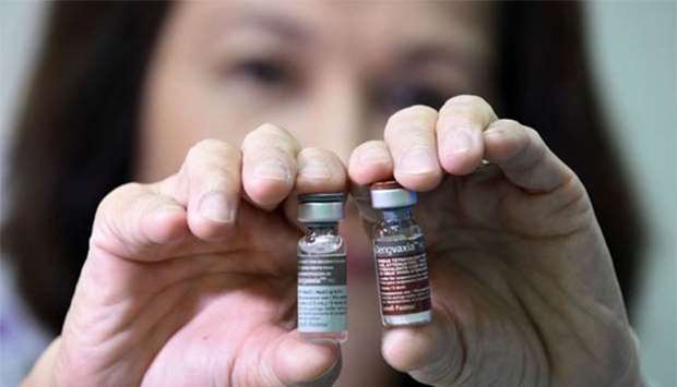 A nurse displaying vials of Sanofi's dengue vaccine Dengvaxia, which has been recalled from local health centres.