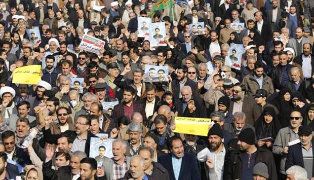 Iranian pro-government protesters take part in a march held after the weekly Friday prayers in central Tehran. AFP