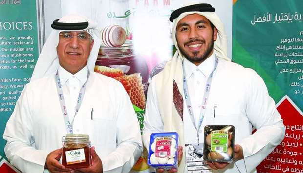 Dr Salem al-Naemi (left) and his son Nasser at their stall at Made in Qatar. PICTURE: Jayaram