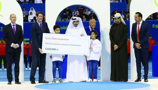 ExxonMobil Qatar presenting a cheque for QR3.65mn to Rise International for the Educate A Child (EAC) programme. Dignitaries at the cheque-presentation ceremony included Alistair Routledge, president and general manager for ExxonMobil Qatar; Fahad al-Sulaiti, chief executive officer of EAA; Nasser bin Ghanim al-Khelaifi, president of Qatar Tennis Federation, and Andrew P Swiger, senior vice-president, Exxon Mobil Corporation. PICTURE: Jayan Orma
