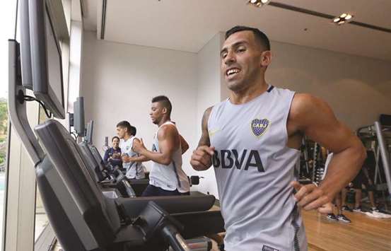 Carlos Tevez trains with teammates after joining Boca Juniors in Buenos Aires on Friday.  (AFP)