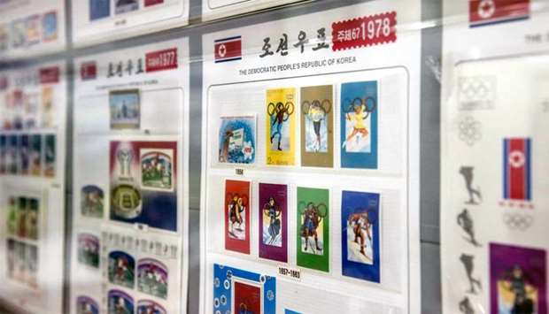 Stamps commemorating North Korea's participation in past winter Olympic Games is displayed at a stamp shop in Pyongyang.