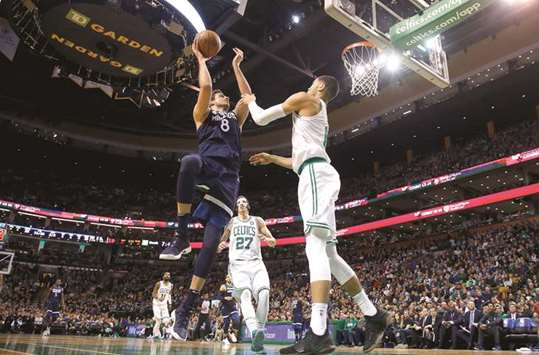 Minnesota Timberwolves forward Nemanja Bjelica (8) shoots over Boston Celtics forward Jayson Tatum during the first half at TD Garden. PICTURE: Winslow Townson-USA TODAY Sports