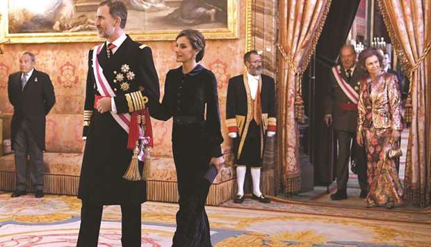 Former king Juan Carlos I (second right) and former queen Sofia (right) follow his son King Felipe VI and Queen Letizia during the Epiphany Day celebrations (Pascua Militar) at the Royal Palace in Madrid.