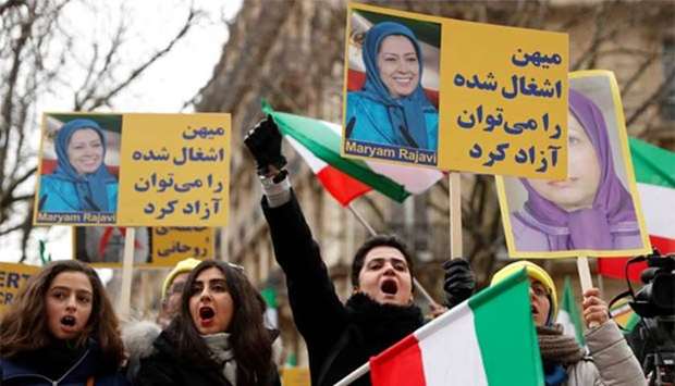 People demonstrate in solidarity with anti-government protests in Iran near the Iranian embassy in Paris on Saturday.