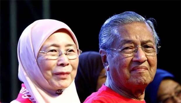 Former Malaysian prime minister Mahathir Mohamad and opposition leader Wan Azizah are seen at a rally in Petaling Jaya, near Kuala Lumpur, in October last year.