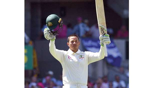 Australiau2019s batsman Usman Khawaja celebrates his century against England on the third day of the fifth Ashes Test at the SCG in Sydney yesterday. (AFP)