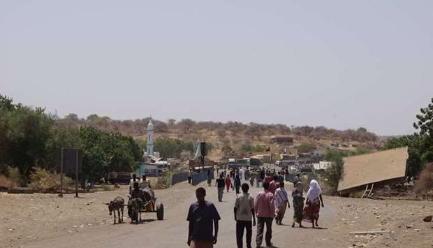 People crossing Sudan-Ethiopia border bridge. File picture