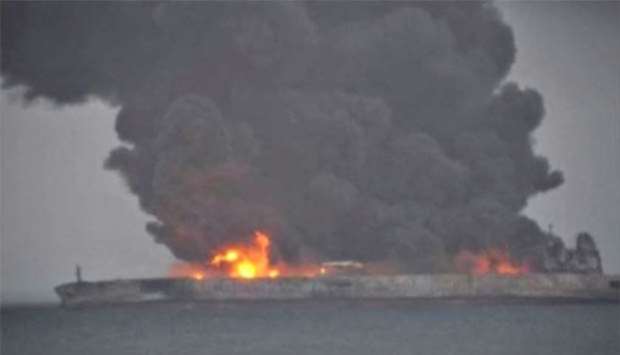 Smoke and fire is seen from Panama-registered tanker Sanchi carrying Iranian oil after it collided with a Chinese freight ship in the East China Sea.