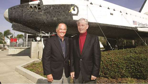 An April 7, 2006, file photo of Space Shuttle mission STS-1 Pilot Bob Crippen (left) and Commander John Young posing at the Visitors Complex at the Kennedy Space Center in Cape Canaveral, Florida.
