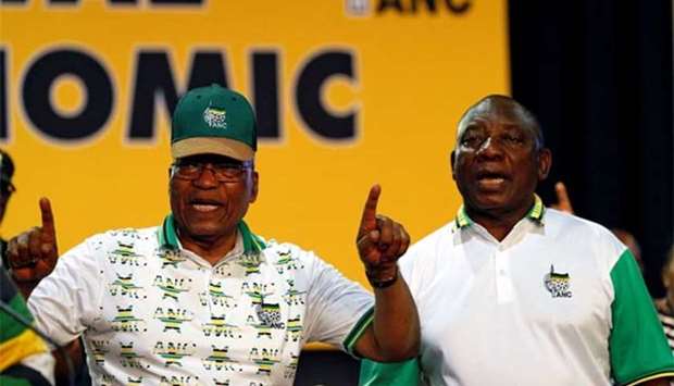 South Africa's President Jacob Zuma sings next to newly elected president of the ANC Cyril Ramaphosa during the 54th National Conference of the ruling African National Congress (ANC) at the Nasrec Expo Centre in Johannesburg last month.