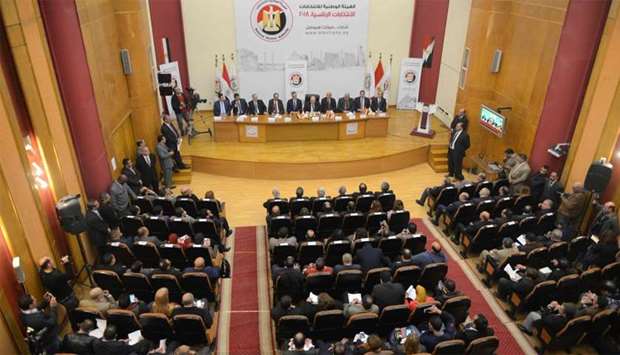 Members of the National Elections Authority give a press conference in Cairo to announce that Egyptians will head to the polls on March 26-28 in the first round of a presidential election.
