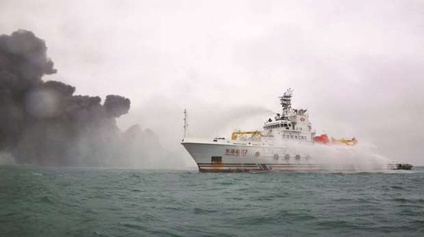 This handout from the Transport Ministry of China taken on January 7, 2018 and released yesterday, shows a Chinese firefighting vessel spraying water on the burning oil tanker Sanchi at sea off the coast of eastern China. Sanchi was ferrying 1mn barrels of condensate - a hydrocarbon liquid thatu2019s used to make petrochemicals - to Daesan, according to a Hanwha Total spokesman.