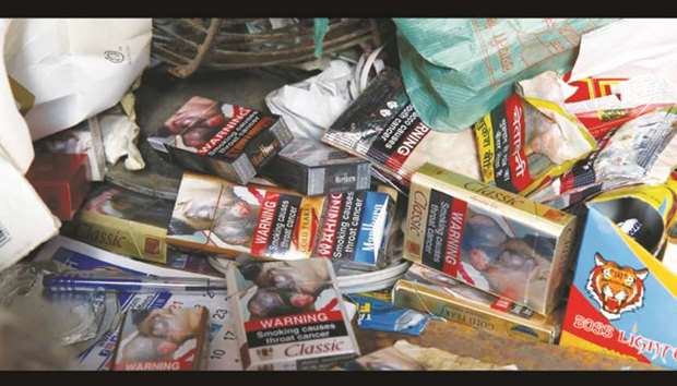Cigarette packets with graphic pictorial warnings are pictured on the counter of a cigarette seller in Mumbai, yesterday.