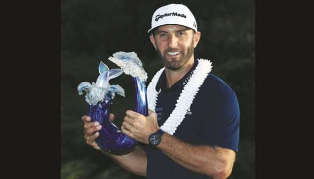Dustin Johnson poses with the trophy after winning Tournament of Champions in Lahaina, Hawaii, on Sunday. (AFP)