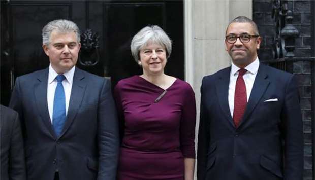 Prime Minister Theresa May poses with Brandon Lewis and James Cleverly outside 10 Downing Street, London, on Monday.