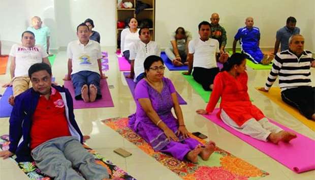 YOGA CLASS: Learning yoga at the Nepalese embassy in Doha.