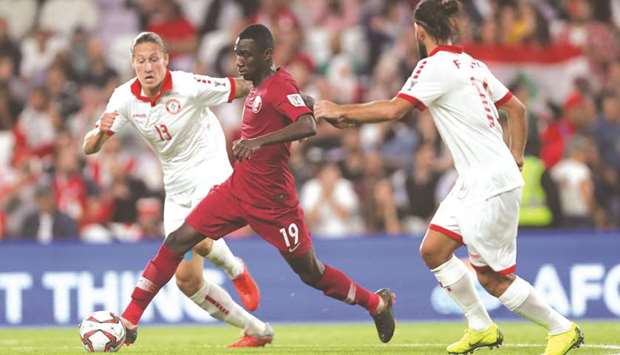 Qataru2019s Almoez Ali (centre) in action against Lebanon during their AFC Asian Cup match yesterday.