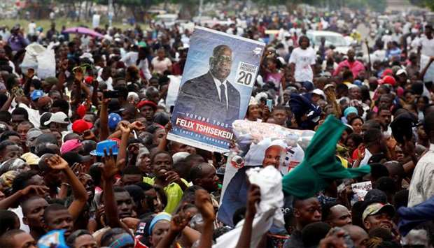 Supporters of Felix Tshisekedi, leader of the Congolese main opposition party, the Union for Democracy and Social Progress who was announced as the winner of the presidential elections, celebrate outside the party's headquarters in Kinshasa