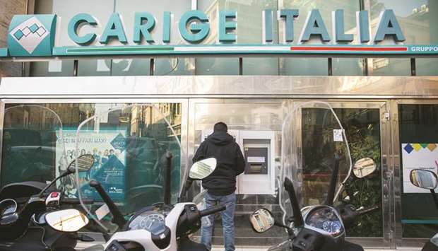 A customer uses an ATM at a Banca Carige branch in Rome. u201cWe are absolutely not working on the idea of nationalisation,u201d Raffaele Lener, one of three European Central  Bank-appointed administrators of Carige, said in an interview with Il Messaggero yesterday. u201cThere is a problem of agitation and that may have an impact on the normal operations of the bank,u201d he said.