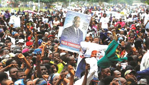 Supporters of Felix Tshisekedi celebrate outside the Union for Democracy and Social Progress partyu2019s headquarters in Kinshasa yesterday.