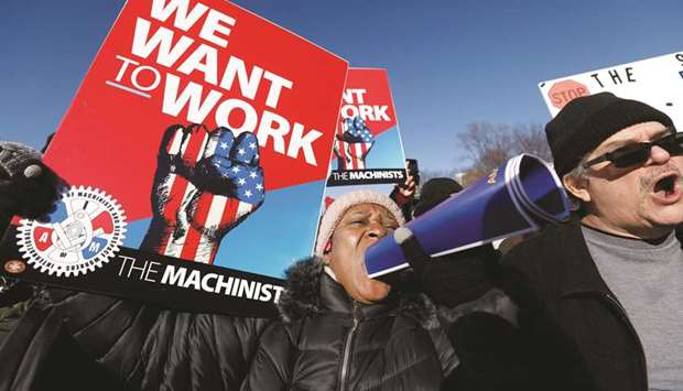 Federal government workers and other demonstrators protest  outside the White House during a u2018Rally to End the Shutdownu2019.