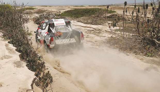 Toyota Gazoou2019s driver Nasser al-Attiyah and co-driver Matthieu Baumel in action in the Dakar Rally.