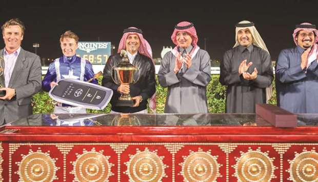 His Highness Sheikh Abdullah bin Khalifa al-Thani (third from right), Qatar Racing and Equestrian Club chairman Issa al-Mohannadi (second from right) and QREC CEO Nasser Sherida al-Kaabi (right) with the winners of the HH Sheikh Abdullah Bin Khalifa Al Thani Trophy after Sharesa won the mile-long race for local Purebred Arabians at the Al Rayyan Park yesterday. PICTURES: Juhaim