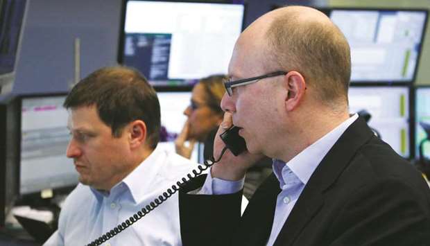 Traders at the Frankfurt Stock Exchange. The DAX 30 lost 0.3% to 10,887.46 points yesterday.