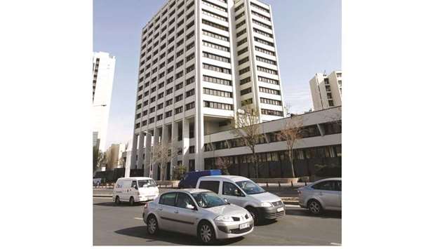 Traffic moves past the central bank of Turkey in Ankara (file). Nineteen of 21 economists surveyed in a Reuters poll said they expected the central bank to keep its one-week repo rate flat at 24%. It is expected to announce the decision on January 16.