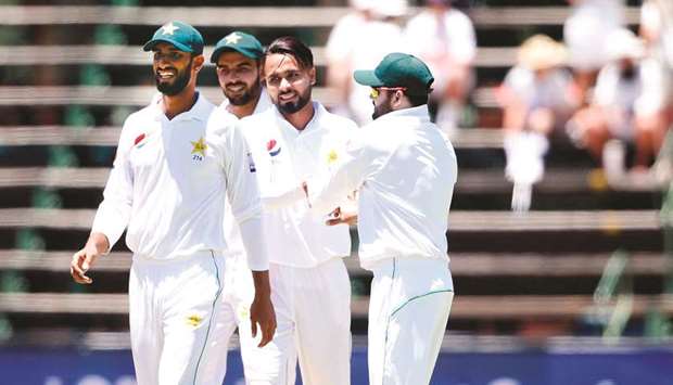 Pakistanu2019s Faheem Ashraf (second from right) celebrates the wicket of South Africau2019s Aiden Markram (not pictured) on the first day of the third Test at Wanderers cricket stadium in Johannesburg yesterday. (AFP)