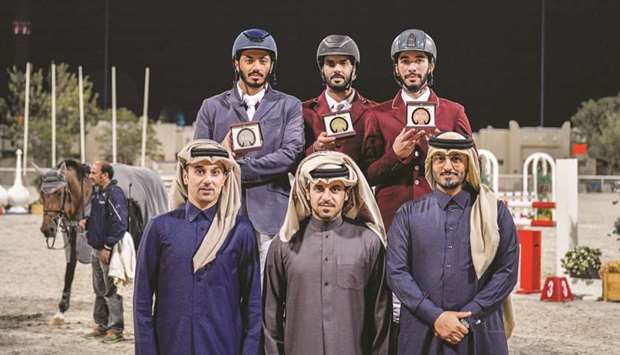 Medium Tour winner Mubarak Youssef al-Rumaihi (top centre), runner-up Said Nasser al-Qadi and third-placed Khalid Mohammed al-Emadi pose with the officials during the sixth round of Hathab series.