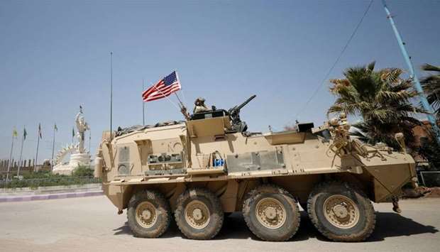 A US military vehicle travels in the town of Amuda