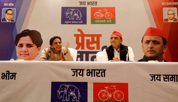 BSP chief Mayawati speaks as Akhilesh Yadav, chief of SP, looks on during a joint news conference to announce their alliance for the upcoming national election, in Lucknow