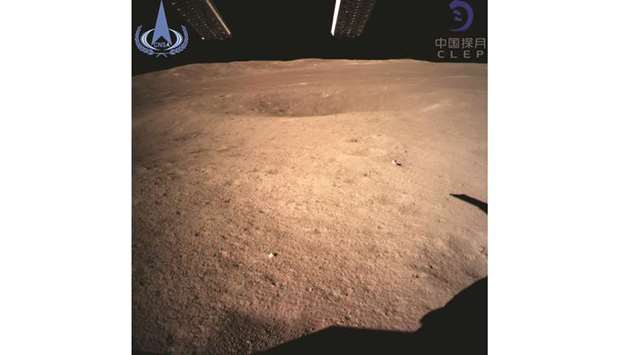 A photograph taken by the Changu2019e-4 probe and released by China National Space Administration shows an image of the u201cdark sideu201d of the moon.