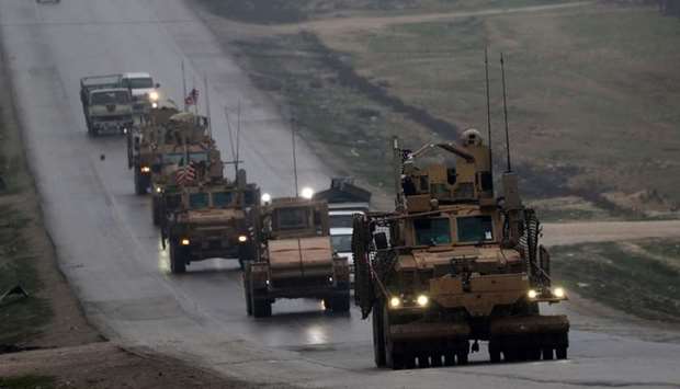 A convoy of US military vehicles rides in Syria's northern city of Manbij on December 30, 2018.