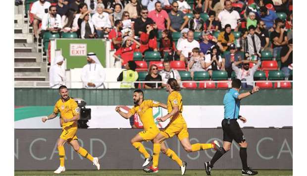 Australiau2019s Jamie Maclaren (left) celebrates after scoring a goal during the 2019 AFC Asian Cup match against Palestine in Dubai on Friday. (AFP)