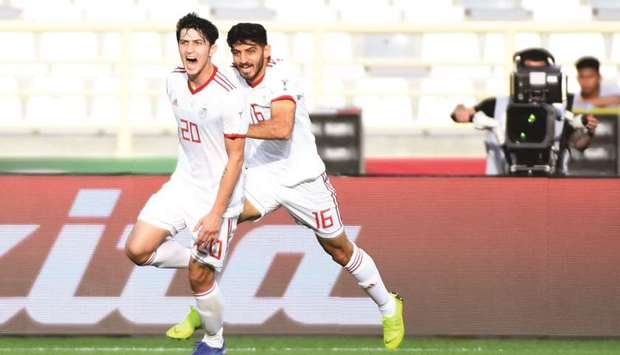 Iran forward Sardar Azmoun (left) celebrates his goal during the 2019 AFC Asian Cup group D match against Vietnam in Abu Dhabi yesterday. (AFP)
