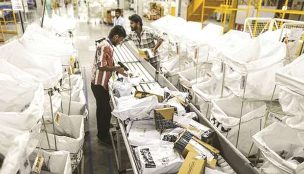An employee is seen at the Amazon fulfilment centre in Hyderabad. Indiau2019s new rules for foreign e-commerce platforms may be designed to protect local companies from Amazon and Walmart, but consumers are likely to suffer the collateral damage.