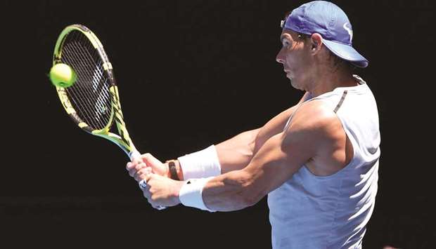 Rafael Nadal of Spain hits a backhand return during a practice session in Melbourne yesterday.