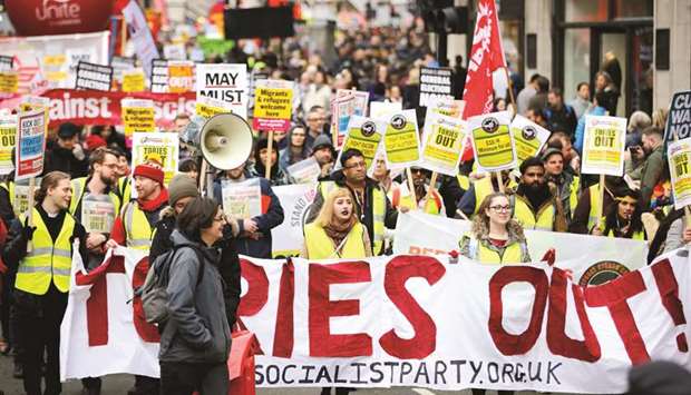 Yellow vest protesters take part in an anti-austerity demonstration in London yesterday.