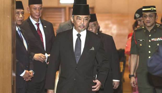 Tengku Abdullah Shah, centre, walking after a meeting in Kuala Lumpur.